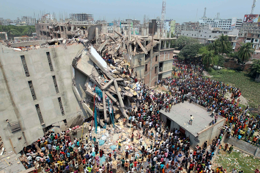 Image: The Rana Plaza Disaster.Rana Plaza Building in collapse, with garment workers pouring onto the street and crowds forming to help assist those who need it.
